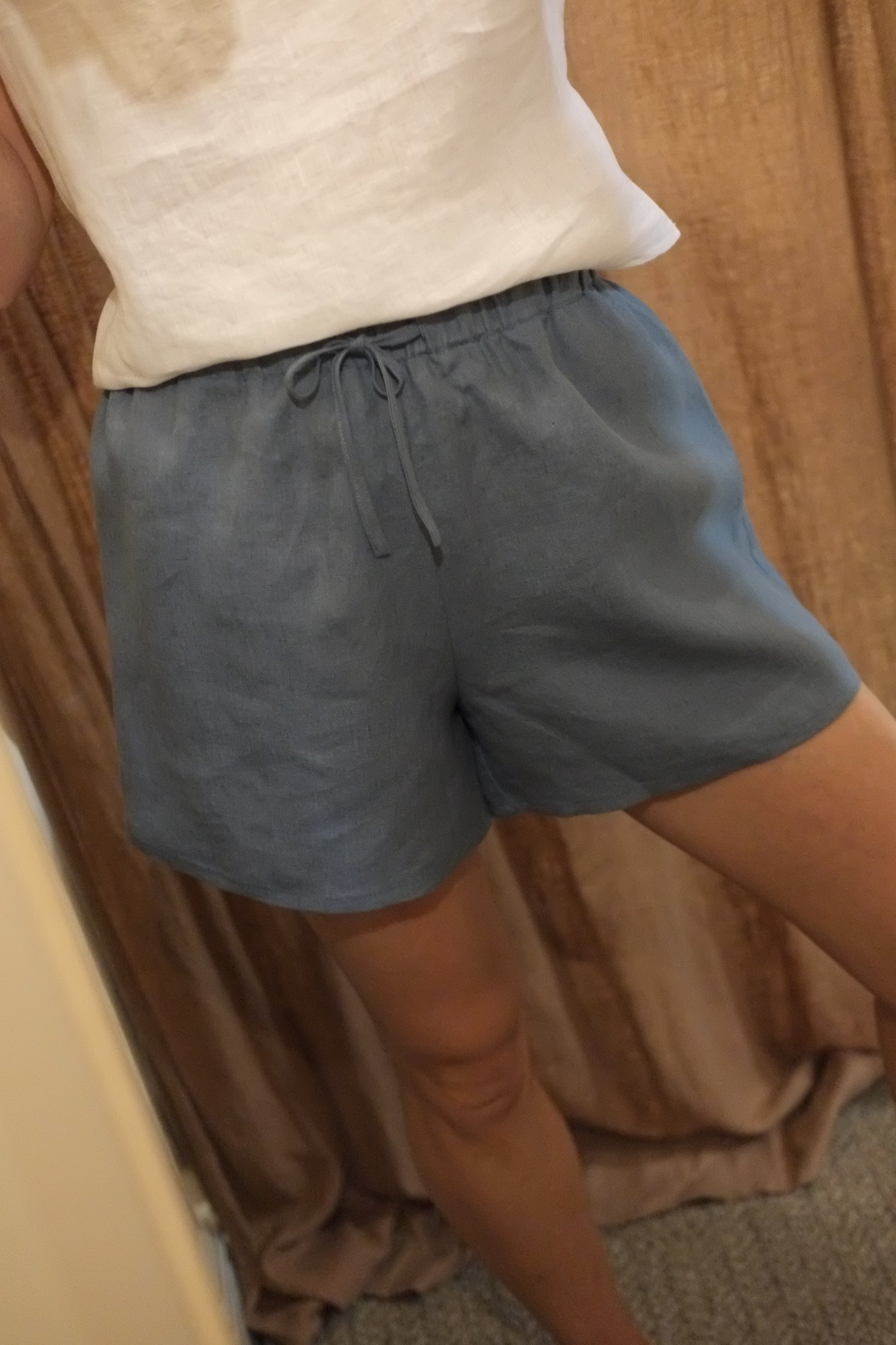 person wearing blue shorts