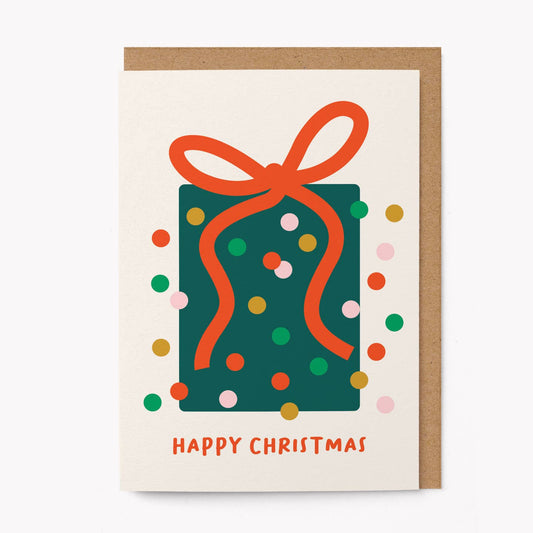 Christmas card with a green present and red ribbon on a white background