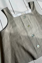 Load image into Gallery viewer, button through natural line tank top laying on a wooden floor
