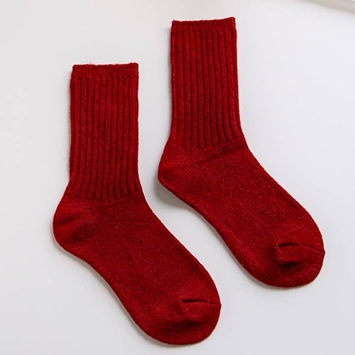 Pair of red socks on a white background