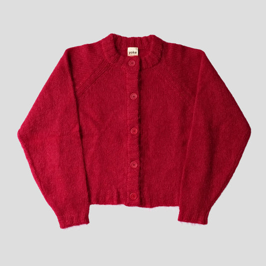 A red cardigan on a white background