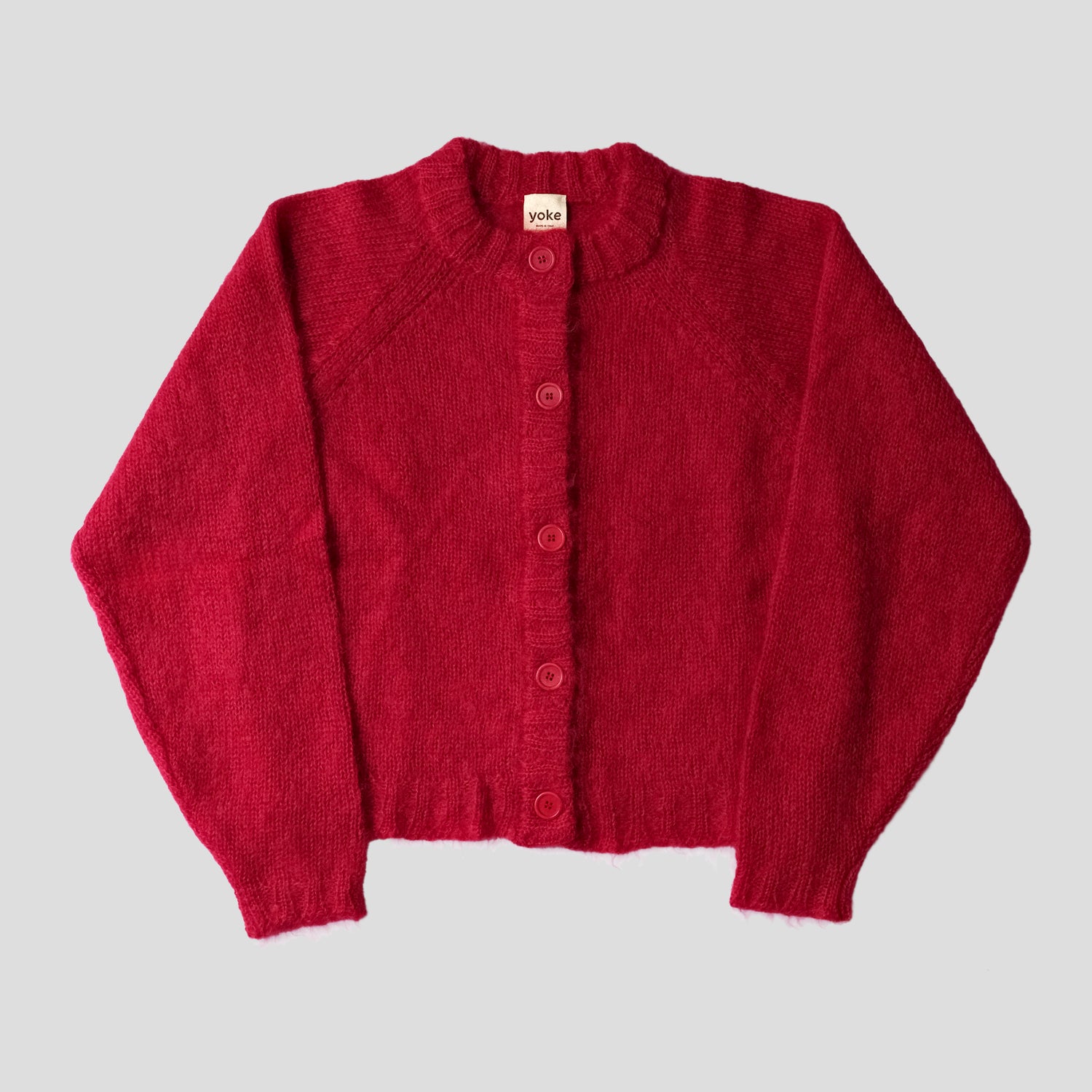A red cardigan on a white background 