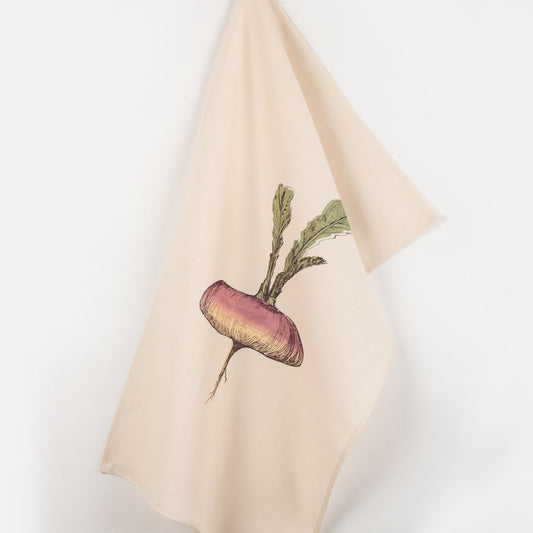 turnip tea towel hanging against a white background