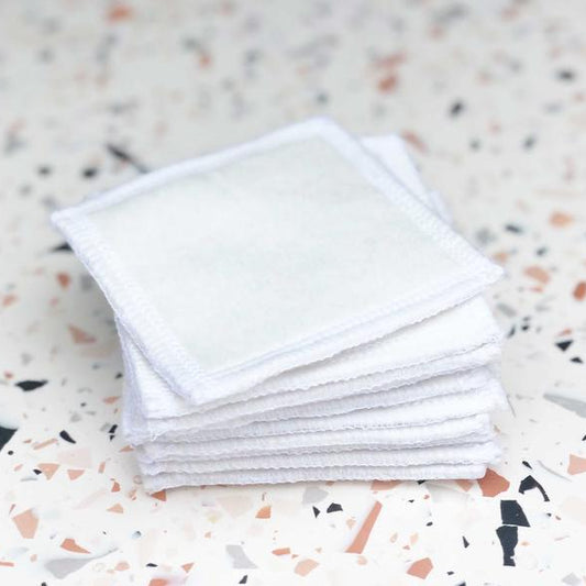 a packed of organic cotton square shaped reusable face pads 